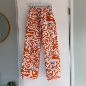 orange and white swirl jeans